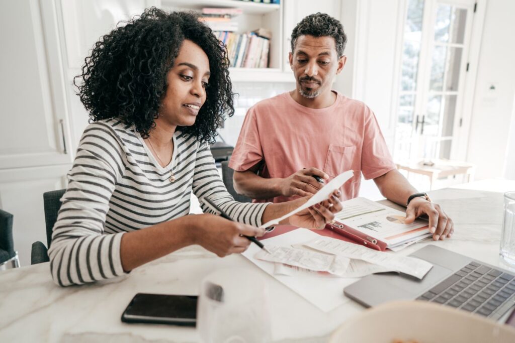 Expat Living a couple managing their finances and paperwork, a common aspect of expat life