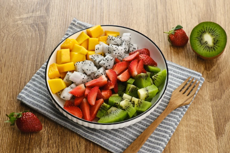 Colorful fresh fruit salad, a tasty way to maintain hydration and avoid signs of dehydration