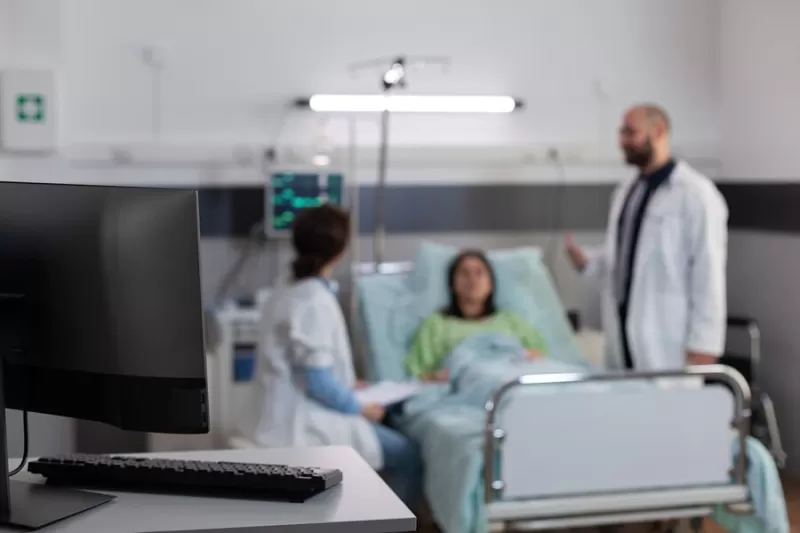 Patient resting in bed using nasal oxygen tube while talking to doctors, medical treatment, screwworm infection